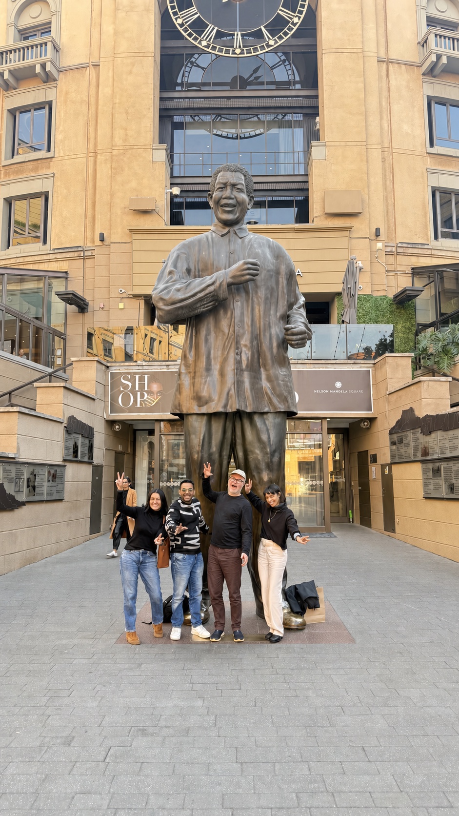 Left to right: Shireen Powell of Project Isizwe, Shivad Singh of Head Start, Adrian DeWitts of Bookbot and Gabby Powell of Project Isizwe at Nelson Mandela Square in Johannesburg