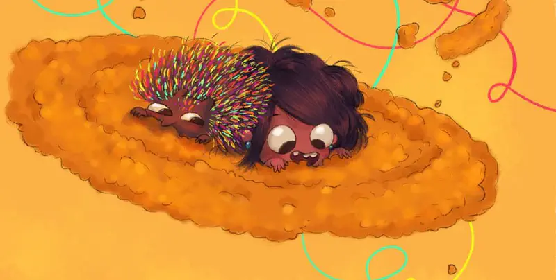 Boy and grown dog playing tug of war with rope toy