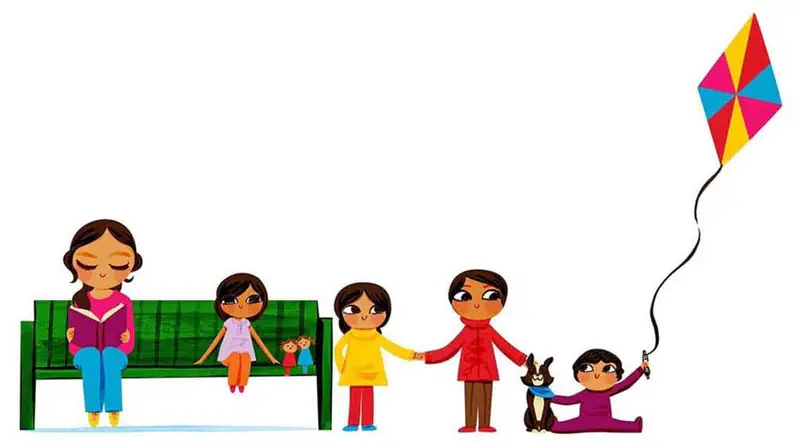 Happy family standing safely on ground next to bench with girl holding kite string and dog