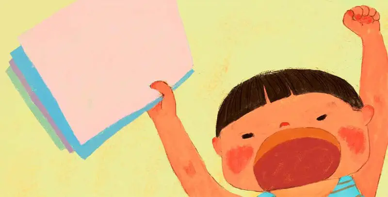 Excited boy with mouth wide open holding up stack of colorful paper celebrating idea