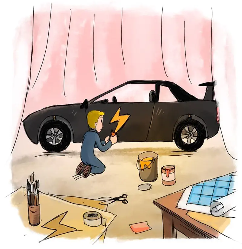 Man kneeling to paint lightning bolt on black race car with paint cans and brushes nearby