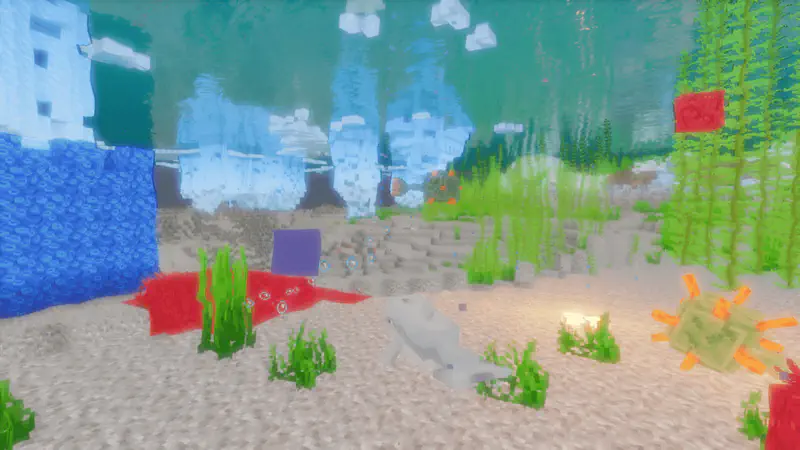 Minecraft underwater scene with colorful coral, seagrass, tropical fish, and a sandy ocean floor with light filtering through water.