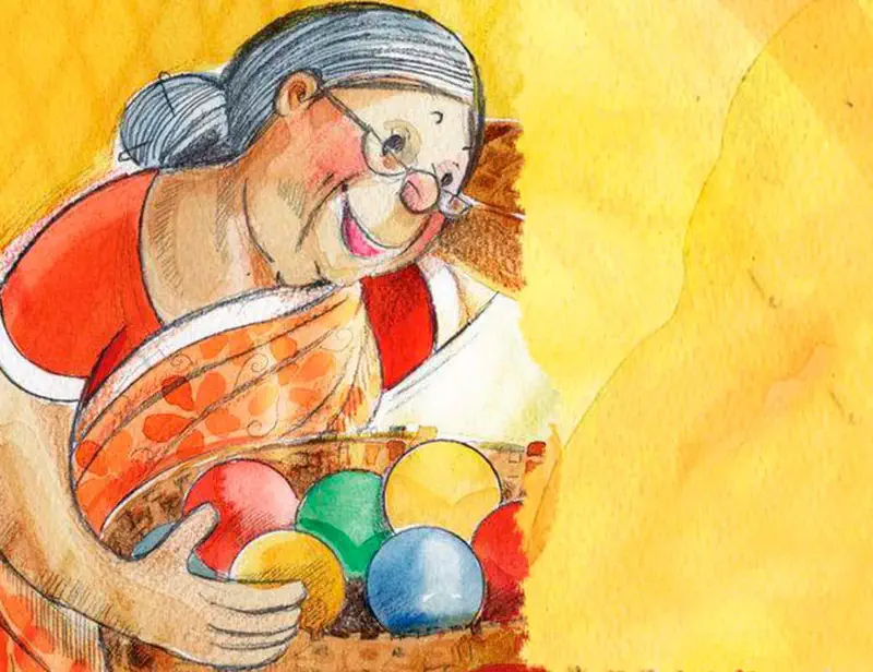 A smiling grandmother in a red and orange sari holds a basket full of colorful balls against a warm yellow background.