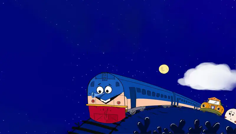 The smiling blue train travels along tracks at night under a starry sky with a full moon and white clouds.
