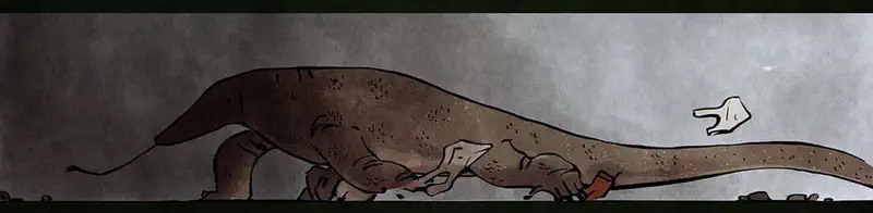 A long monitor lizard crawling low to the ground in a dark space searching for something with its tongue out.