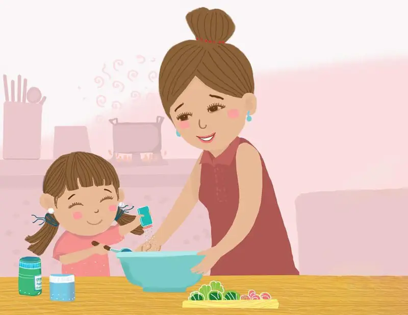 A mother and daughter cook together in the kitchen, with the daughter adding seasoning to a blue bowl while vegetables and ingredients sit on the counter.