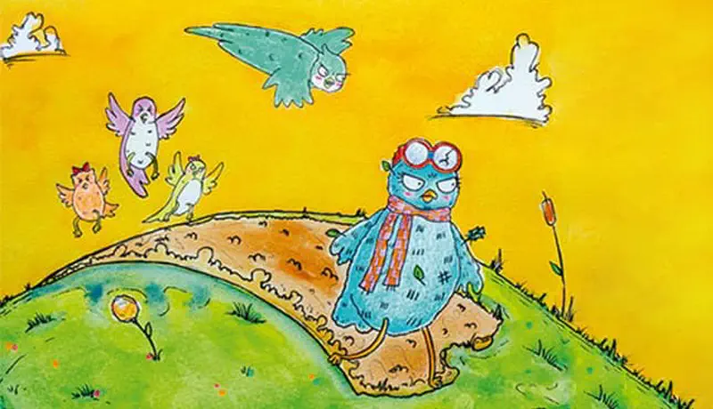 The blue owl with goggles and scarf stands sadly on the ground while other birds fly happily in the golden yellow sky above.
