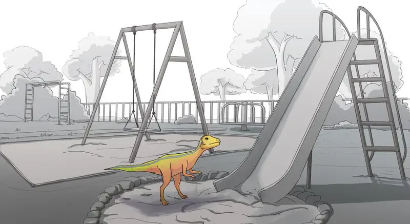 A small orange and yellow dinosaur standing alone in a playground with swings and a slide, drawn in grayscale background.