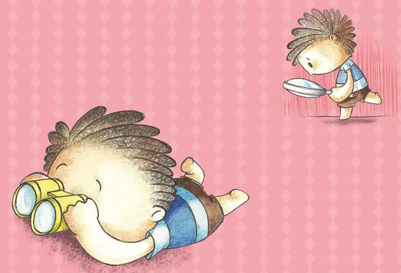 A child with braided hair lies on the floor looking through yellow binoculars. In the corner, the same child searches with a magnifying glass.