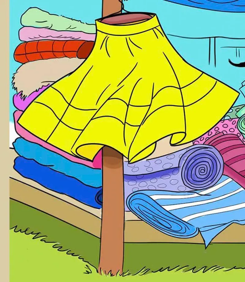 Yellow skirt displayed on pole at market stall with colorful folded fabrics and rolled textiles.