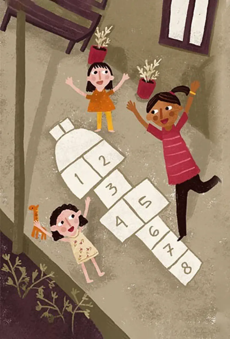 Three girls playing hopscotch drawn on ground with potted plants and small toy giraffe nearby.