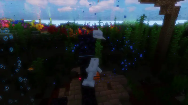Underwater Minecraft scene with drowned zombie mob walking through colorful coral reef area.