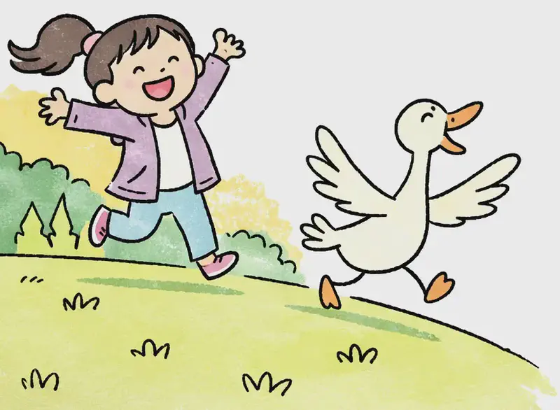 On the left side of the image, Girl is running energetically across a grassy hillside, one arm raised high and a big, excited grin on her face. Just ahead of her, Duck is sprinting forward with wings fully spread, beak open, racing alongside Girl. The outdoor scene features a gentle green slope with small tufts of grass, backed by clusters of trees and warm golden-yellow foliage, with the right side of the image opening to plain light background.