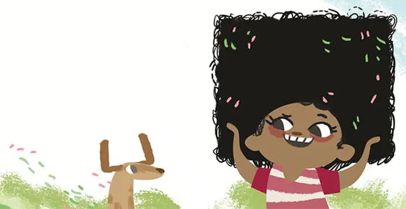 Happy girl with big curly hair raising arms with confetti, dog standing nearby in field.