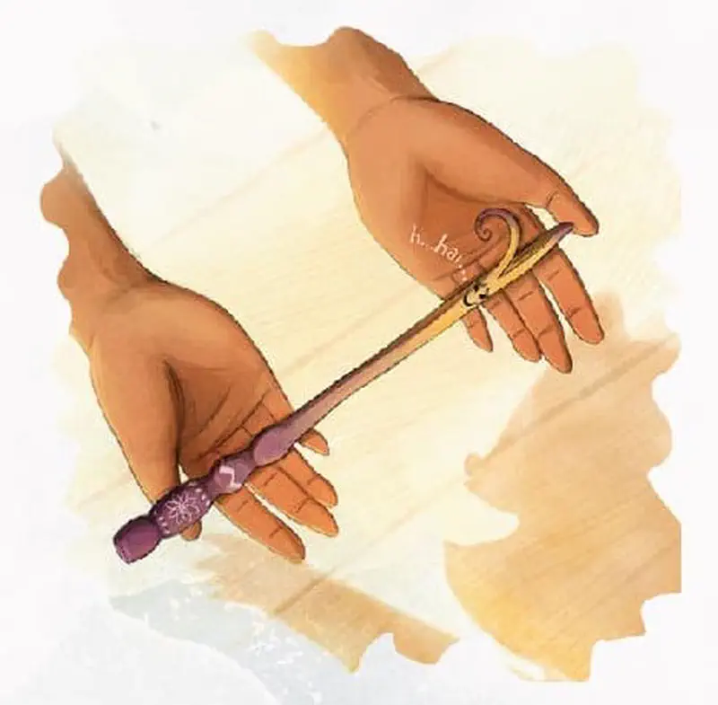 Two hands holding thin wooden wand with purple decorated handle and string loop at end.