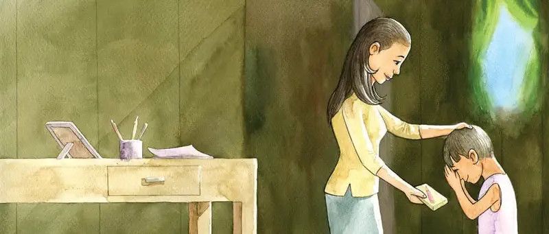 Mother in yellow top gives a pencil box to her shy son who covers his face, with desk and supplies nearby.