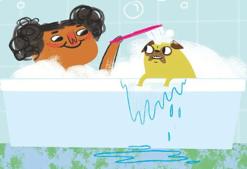 A smiling girl scrubs a happy clean yellow pig with a brush in a bubbly bathtub.