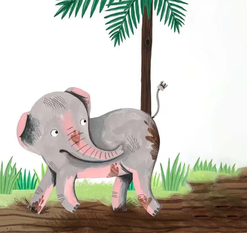 A happy gray elephant walks under a palm tree on a path through green grass in a jungle.