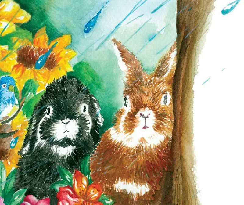A black and white rabbit and brown rabbit sit together by a tree with sunflowers and a blue bird.