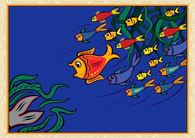 An orange and red fish leads a large school of colorful fish swimming together through blue water with flowing green seaweed.
