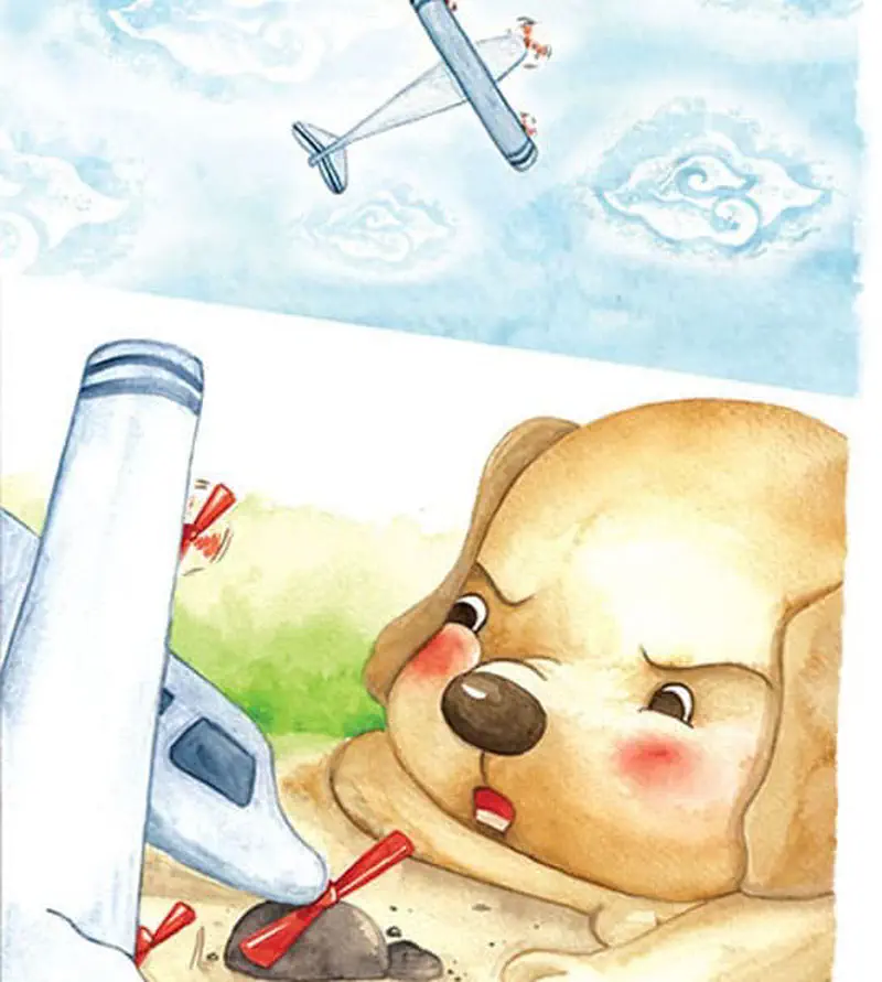 A cute tan puppy lies on the ground looking at a broken toy airplane. Another toy plane flies in the blue sky with fluffy clouds above.