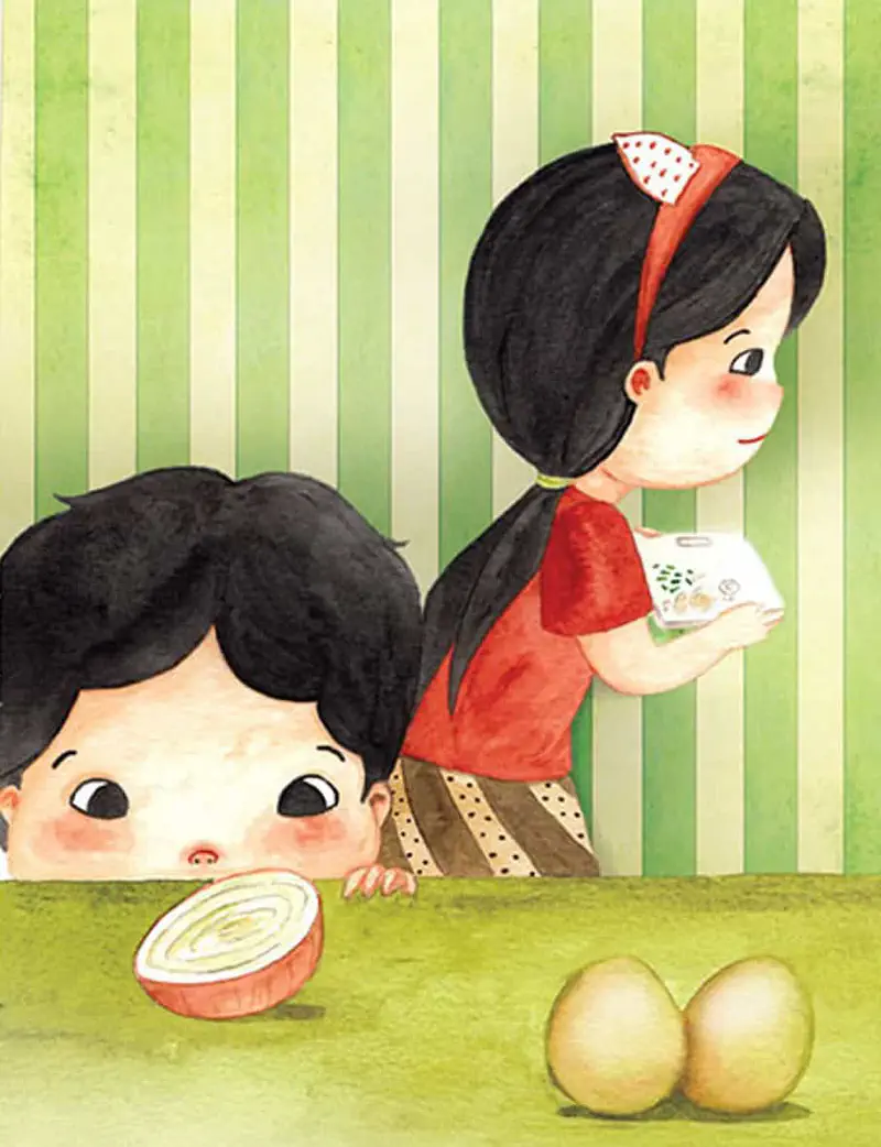 A boy stares curiously at an onion slice on the counter while his sister holds a box behind him in a kitchen with green striped wallpaper and eggs nearby.