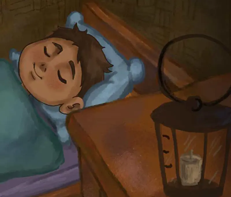 A boy sleeps peacefully in bed with a green blanket while an unlit lantern sits on the bedside table.