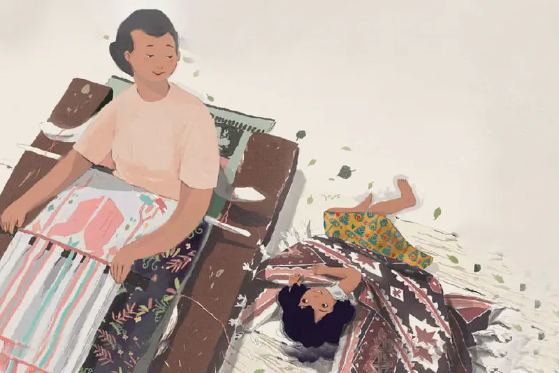 A mother sits at a loom weaving while her daughter lies playfully on colorful traditional woven textiles with leaves floating around.