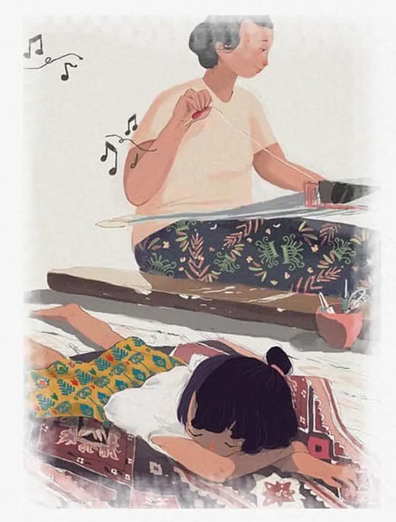 A grandmother hums while sewing as her granddaughter lies on a woven textile watching her work in a peaceful moment together.