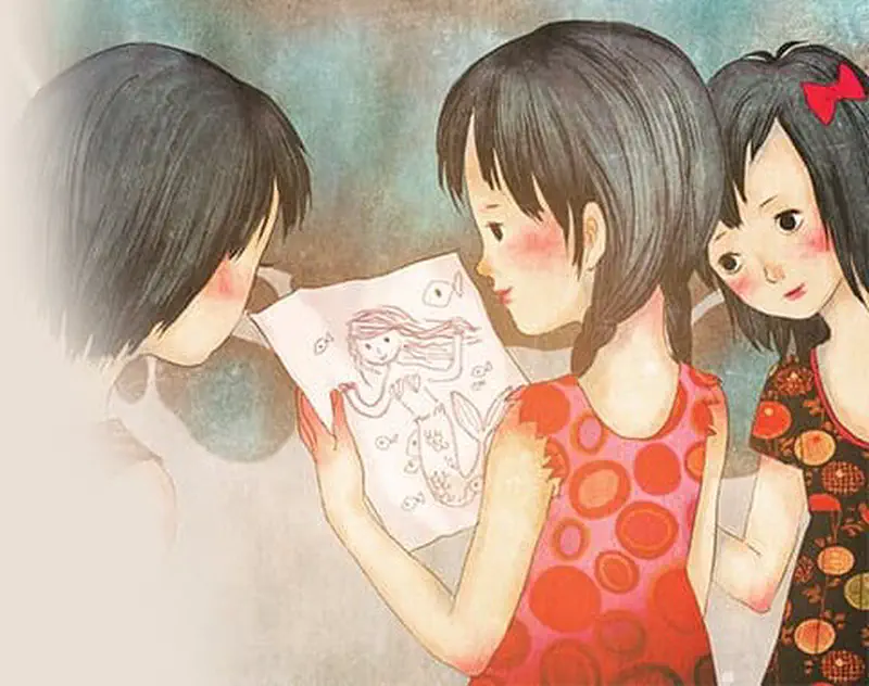 Three children look at a drawing of an underwater adventure with fish and sea creatures on a piece of paper.