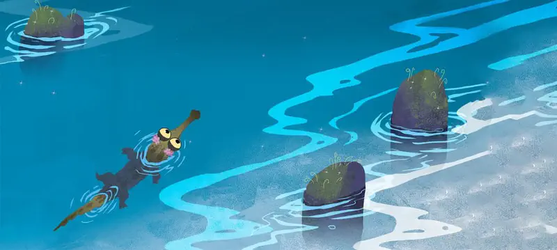 A small crocodile with a pink flower swims through deep blue water past mossy rocks from an aerial view.