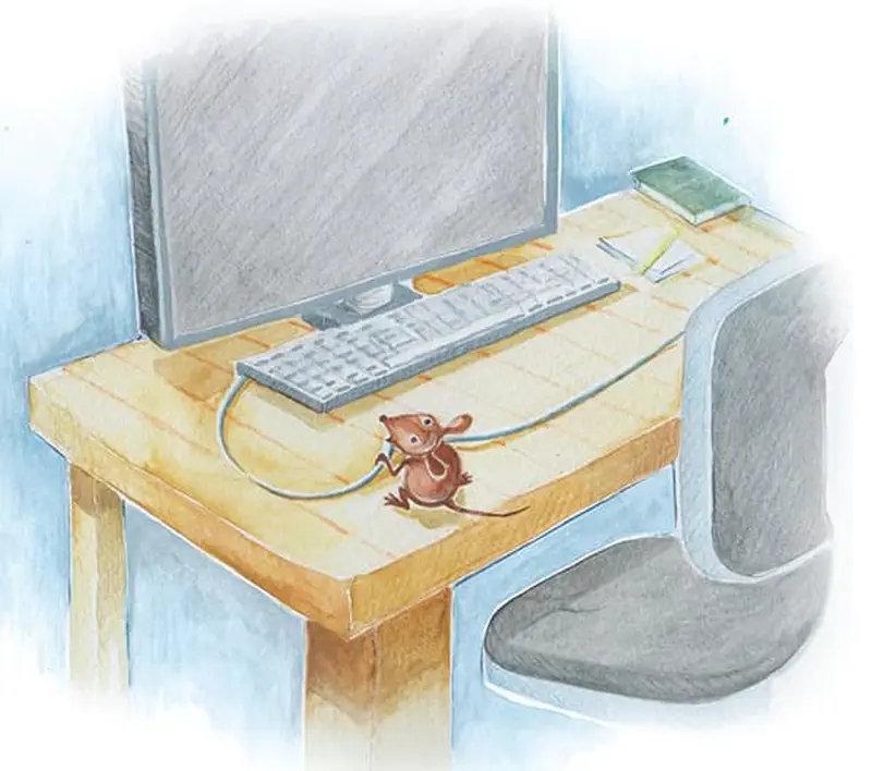 A small brown mouse nibbles on a computer cable on a wooden desk with a monitor, keyboard, and office chair.