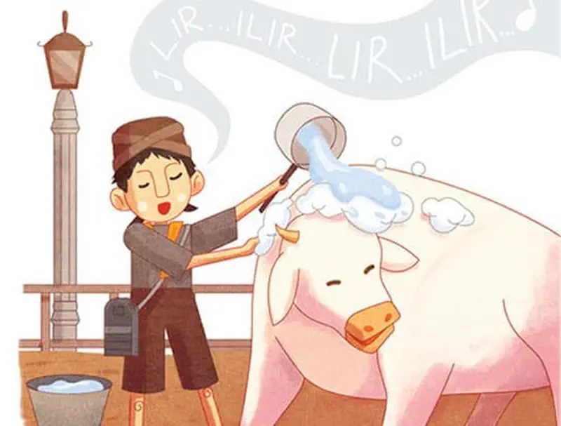 A boy in traditional clothing sings while washing a happy white calf with soapy water near a lamp post and bucket.