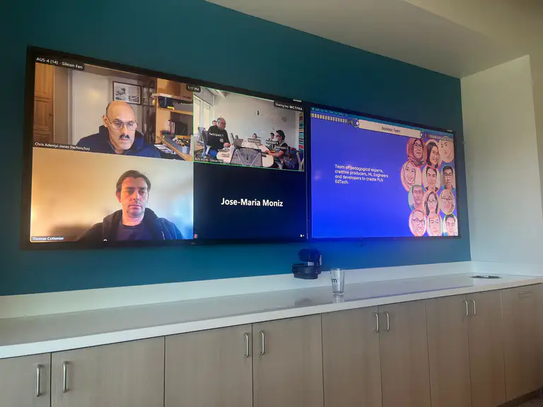 Hybrid workshop session with remote Arm participants and Bookbot team presentation on dual screens