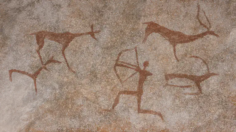 Cave painting showing hunters and animals